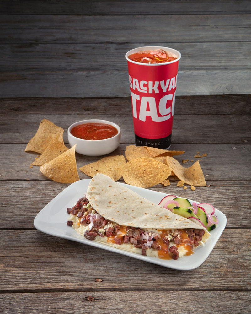 Grilled quesadilla with chips, salsa, and drink from Backyard Taco