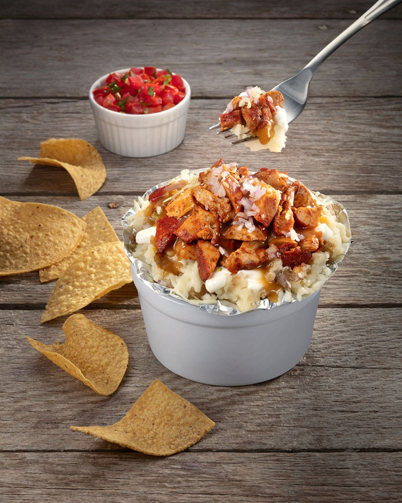 Loaded bowl with grilled meat, rice, and fresh toppings from Backyard Taco