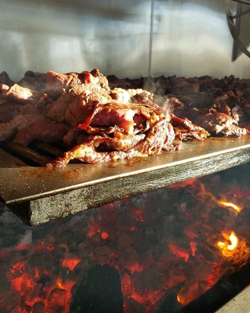 Mesquite-grilled meat for fresh Backyard Taco drive-thru orders