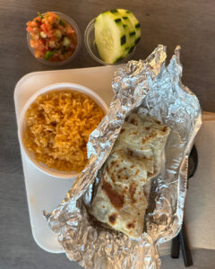 Backyard Taco burrito with chips, salsa, rice, beans, and drinks