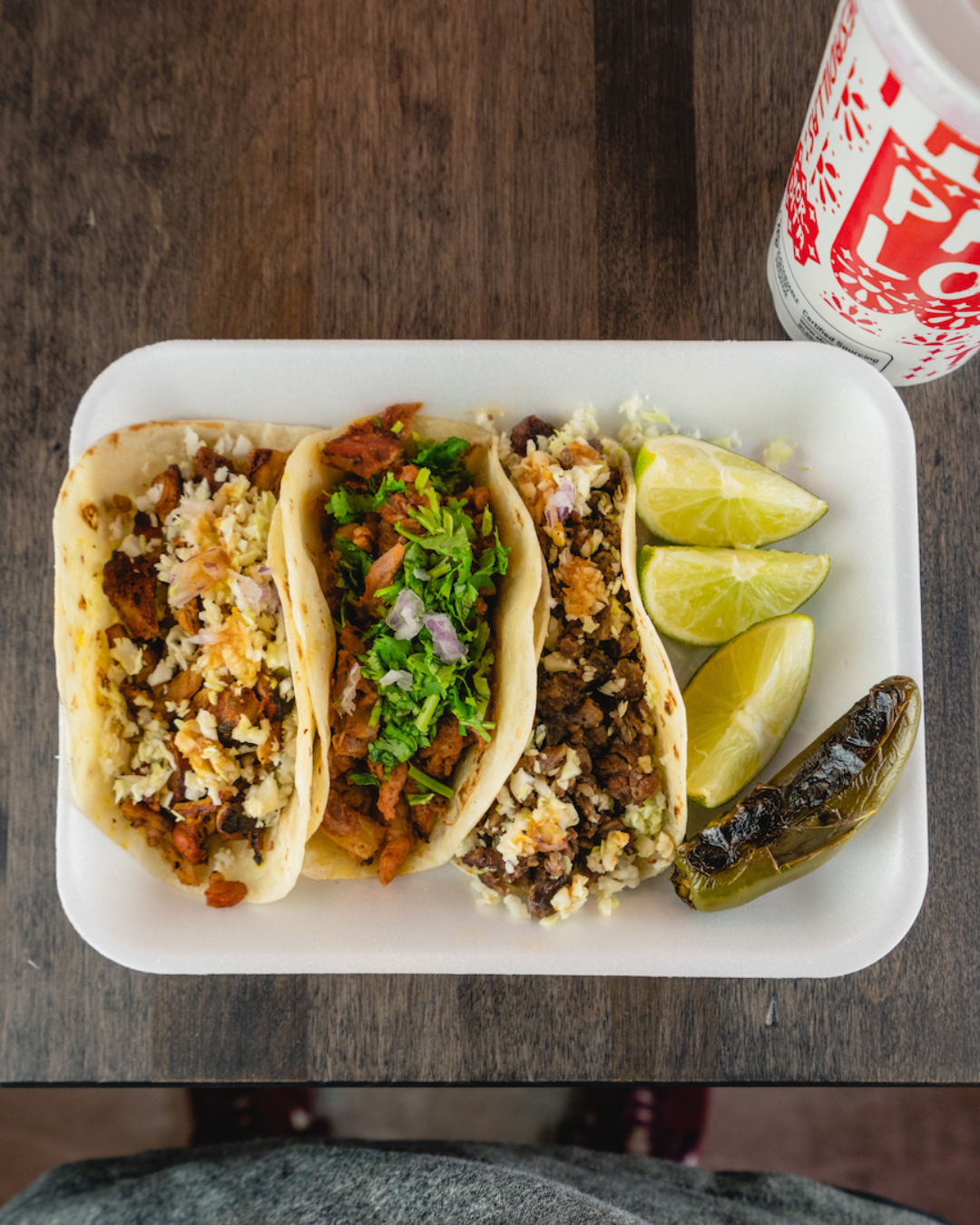 Backyard Taco street tacos with onion, cilantro, lime, salsa, and mesquite-grilled meat